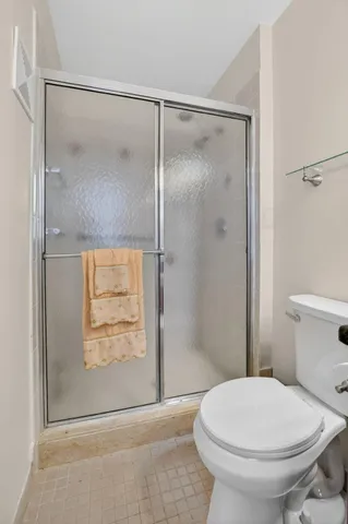 a bedroom with a bed and a chair