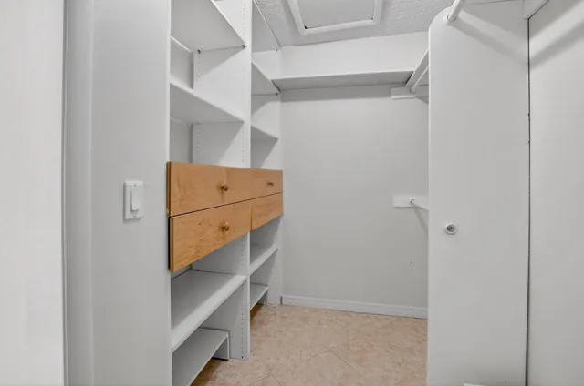a view of a livingroom with wooden floor and cabinet