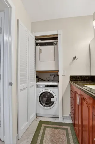 a view of a swimming pool and tall trees