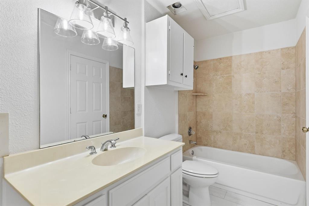 19 Timbergreen Circle Denton, TX 76205 - Photo 33 of 40 a bathroom with a sink a toilet and shower