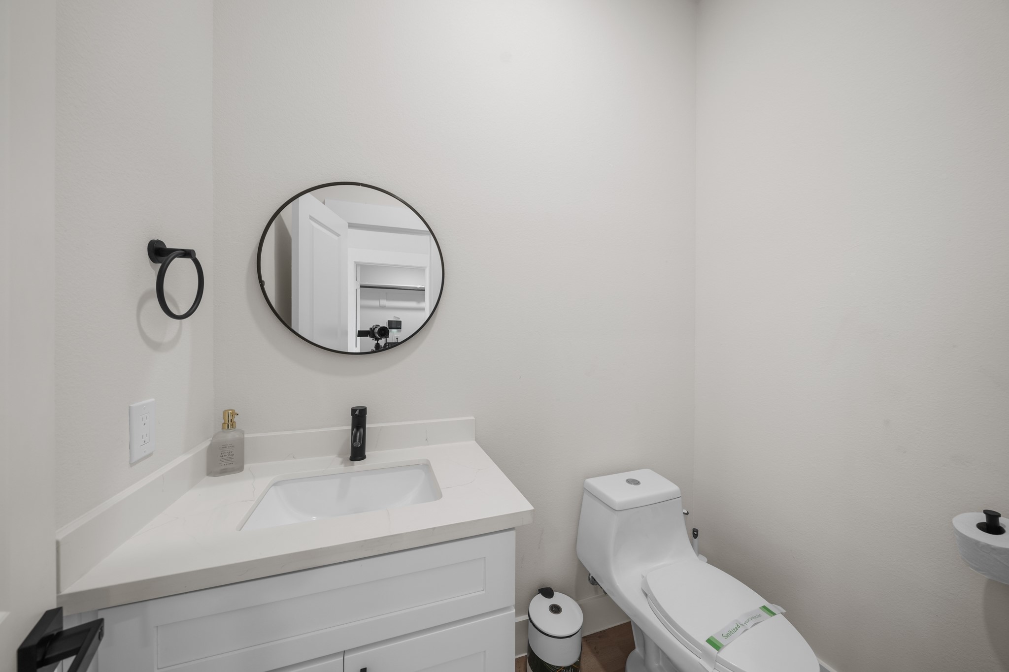 6835 Weston Street, Unit A Houston, TX 77021 - Photo 4 of 18 a bathroom with a sink mirror and toilet