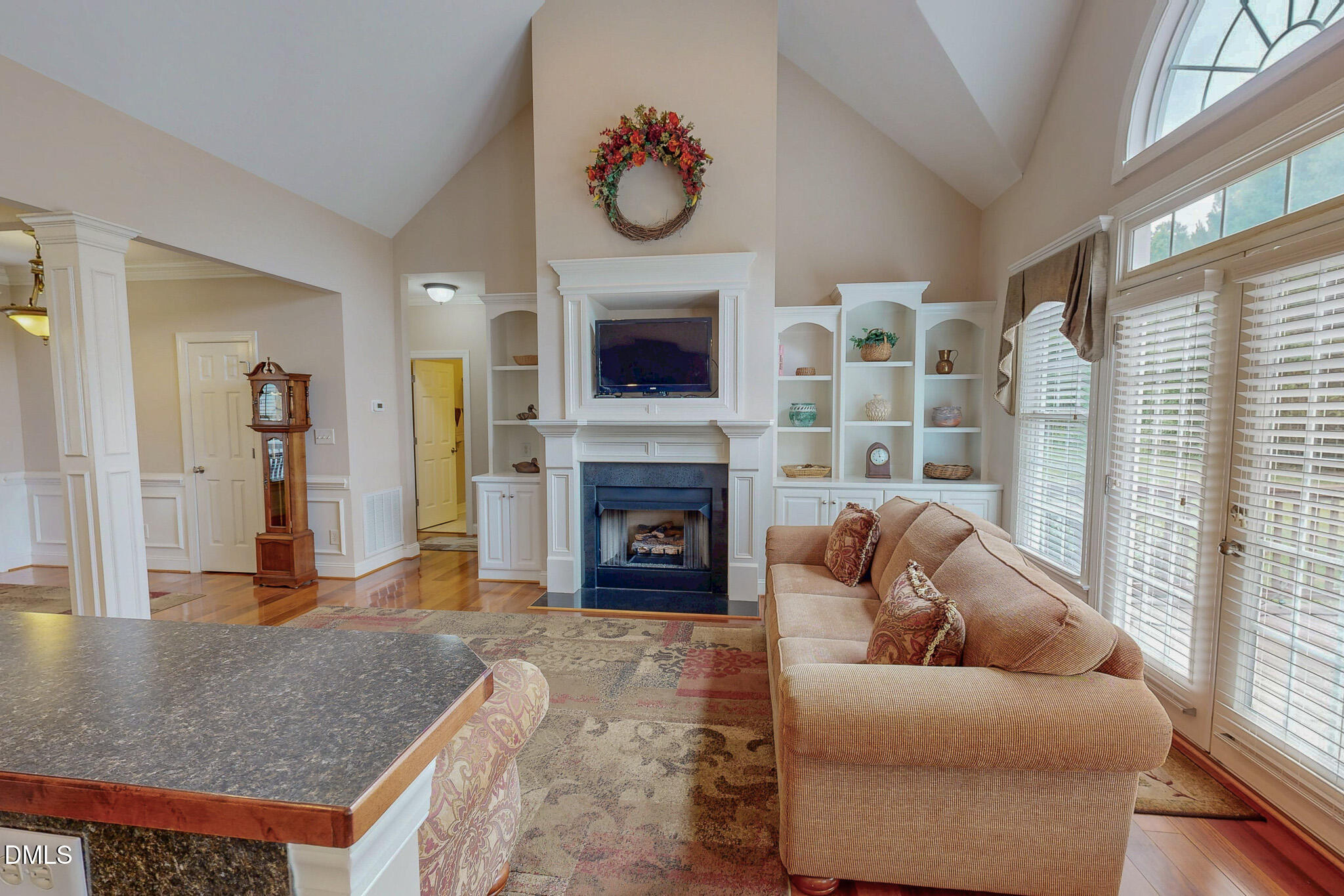 115 Duncan Plantation Road Timberlake, NC 27583 - Photo 31 of 48 a living room with furniture a fireplace and a large window