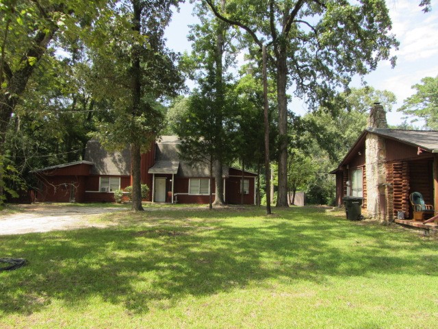 1368 Fish Hatchery Road Huntsville, TX 77320 - Photo 14 of 33 side view of triplex and cabin