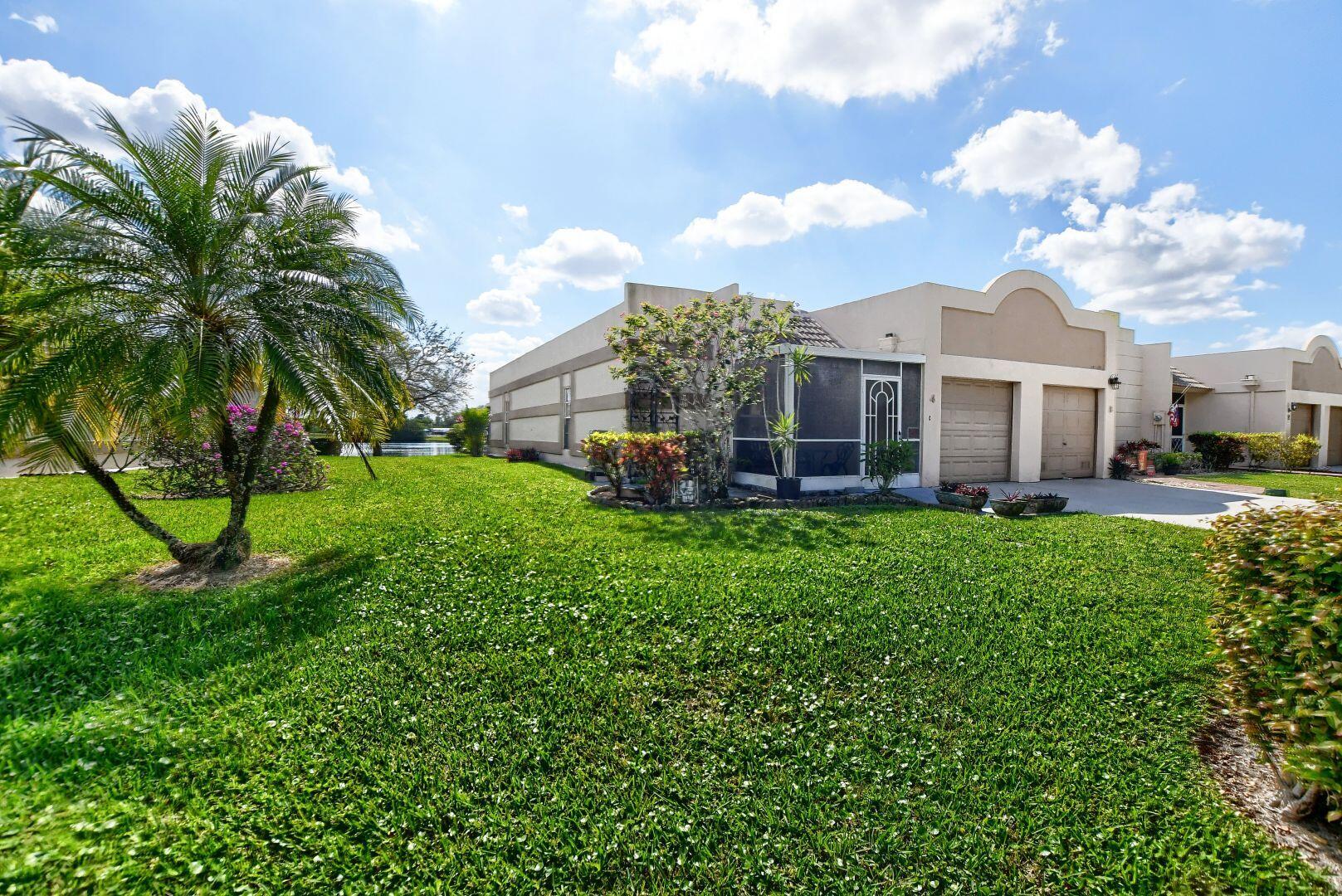 9244 Flynn Circle, Unit 4 Boca Raton, FL 33496 - Photo 3 of 41 Sideview