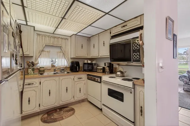 a kitchen with stainless steel appliances granite countertop a stove and a sink