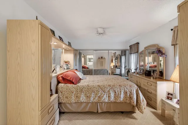 a bedroom with a bed and lamp