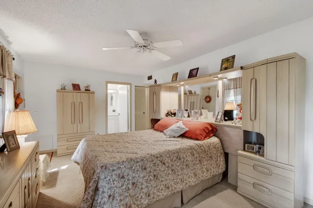 a bedroom with a bed and a mirror