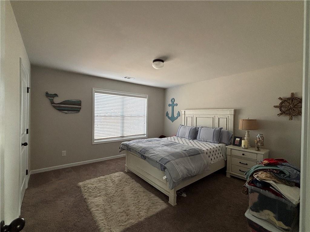 3459 In Bloom Way Auburn, GA 30011 - Photo 23 of 35 a bedroom with a bed and a window