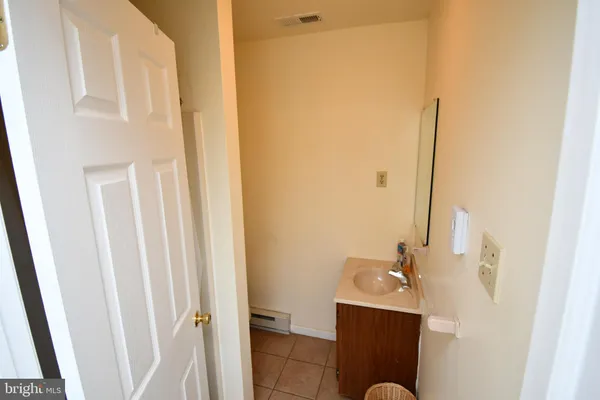 a bathroom with a sink and mirror