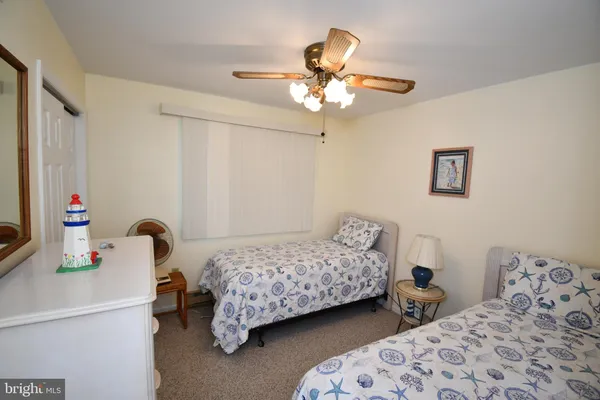 a bedroom with bed and a window