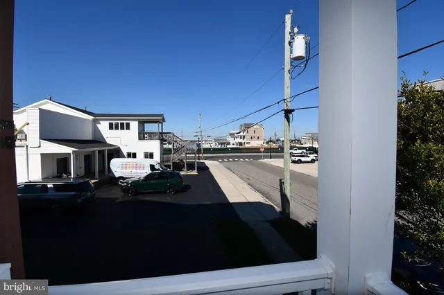 a view of living room with furniture and a fireplace