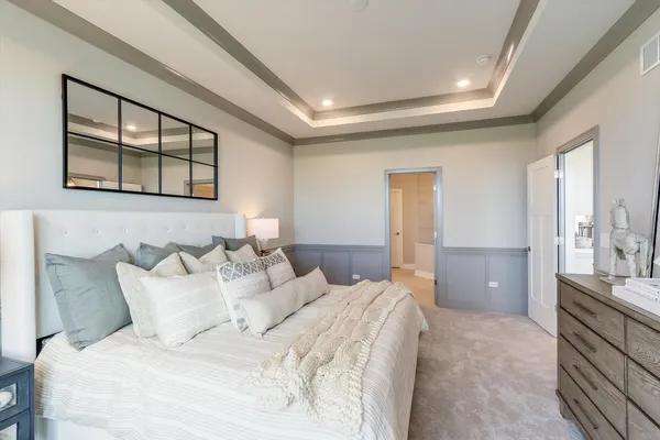 a bedroom with a bed and a couch