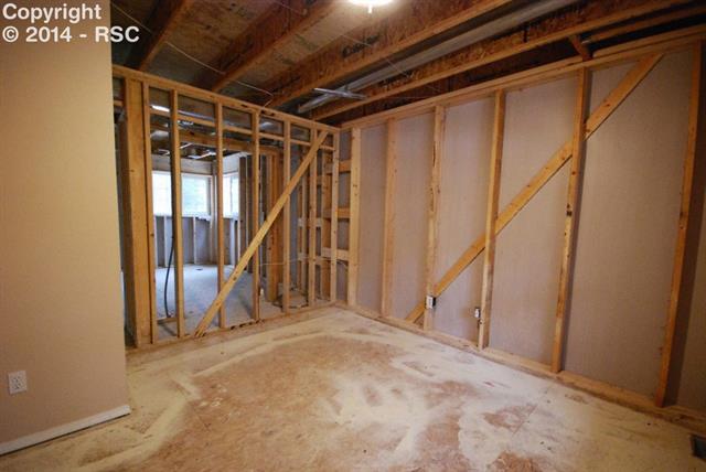 9575 Hardin Road Colorado Springs, CO 80908 - Photo 5 of 24 To the right of the entry is the formal dining area/office. Carpeting, insulation, drywall etc, will be installed.