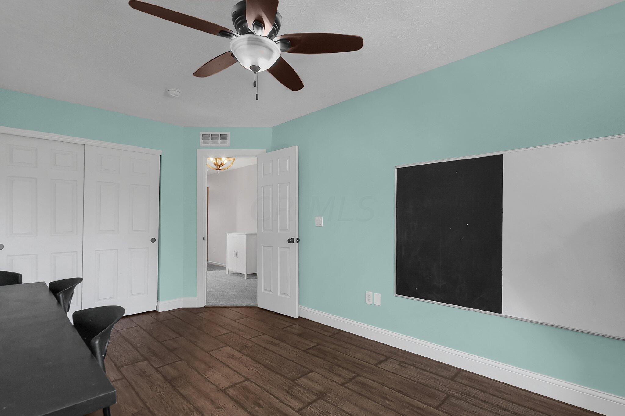 3620 Hyatts Road Powell, OH 43065 - Photo 33 of 54 2nd floor bedroom with mint green walls and brown LVT flooring.