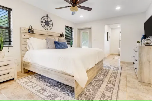 a large white bed in a white room