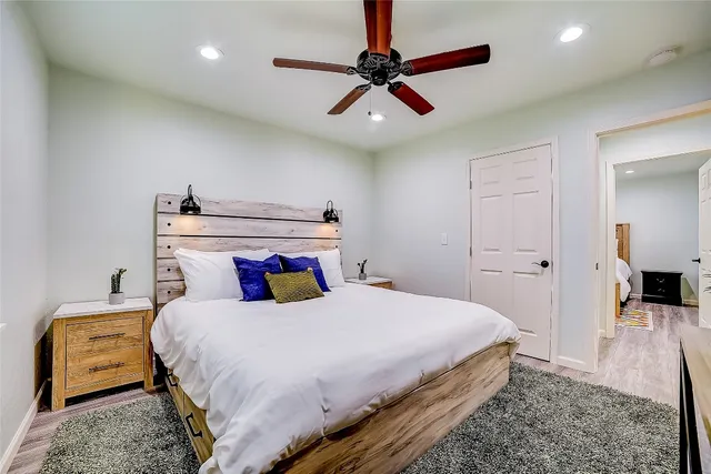 a bedroom with a bed and a view of bathroom