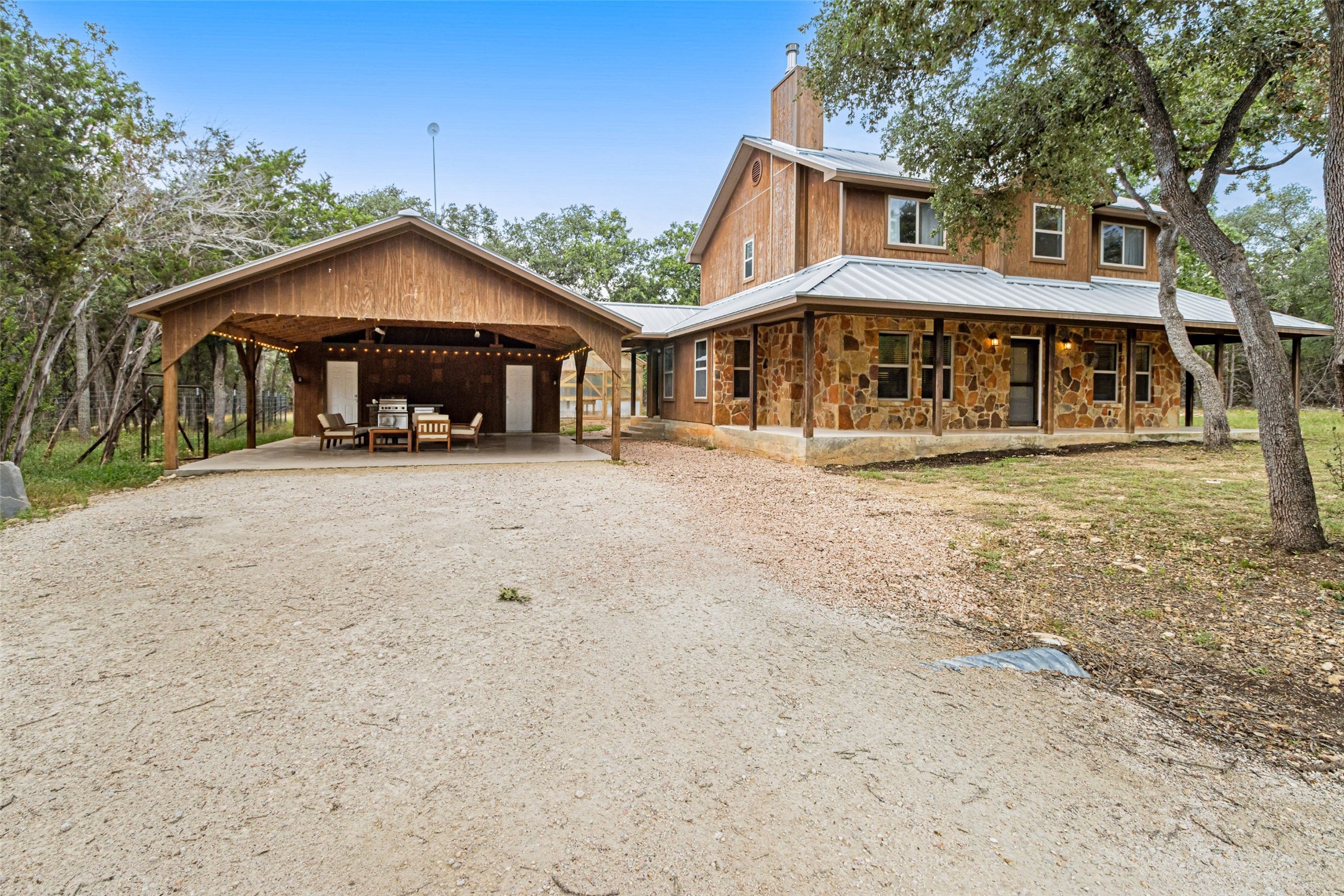 1374 Forest View Drive Blanco, TX 78606 - Photo 7 of 27 Front of Main house with carport