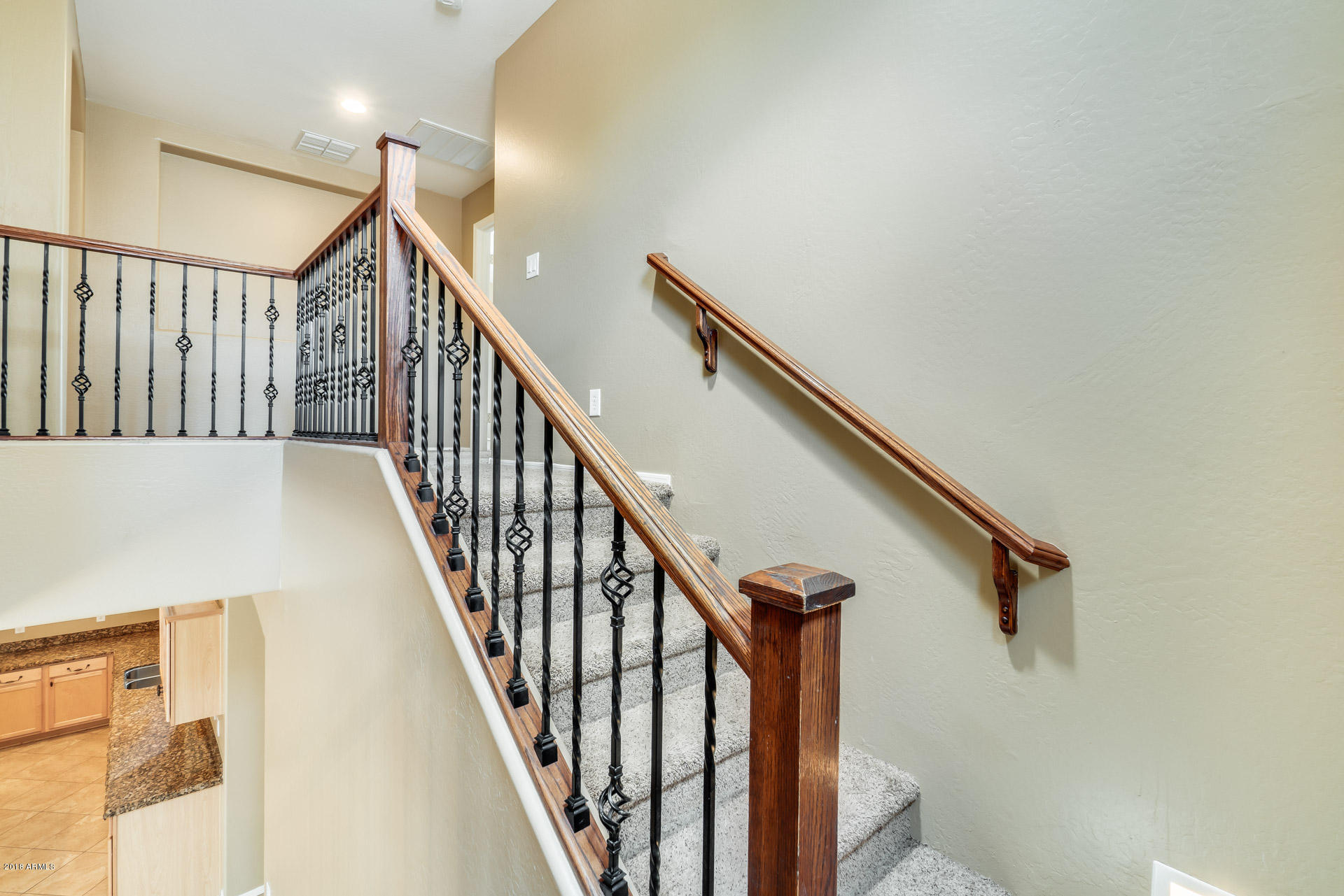 3250 East Blue Ridge Way Gilbert, AZ 85298 - Photo 26 of 44 a view of staircase with railing and white walls