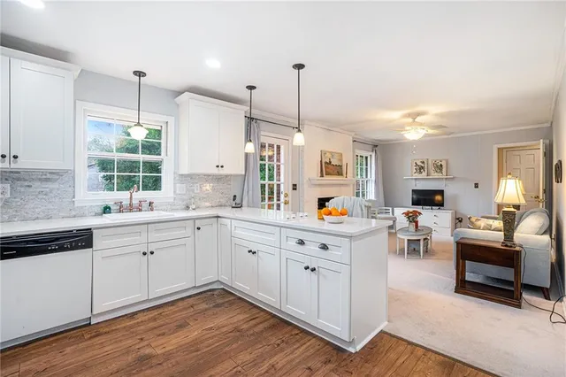 a kitchen with sink cabinets and window