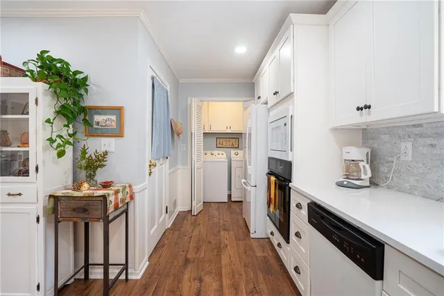 a kitchen with a refrigerator and a sink
