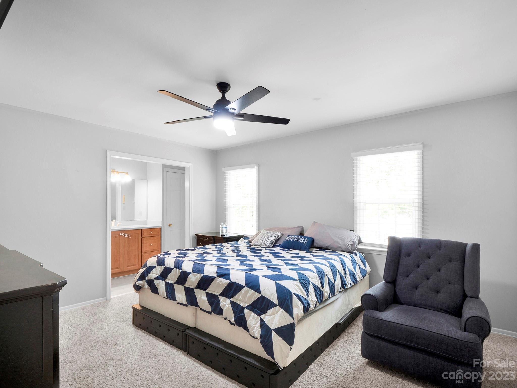 8072 Knights Bridge Road Charlotte, NC 28210 - Photo 11 of 23 a bedroom with a bed couch and window