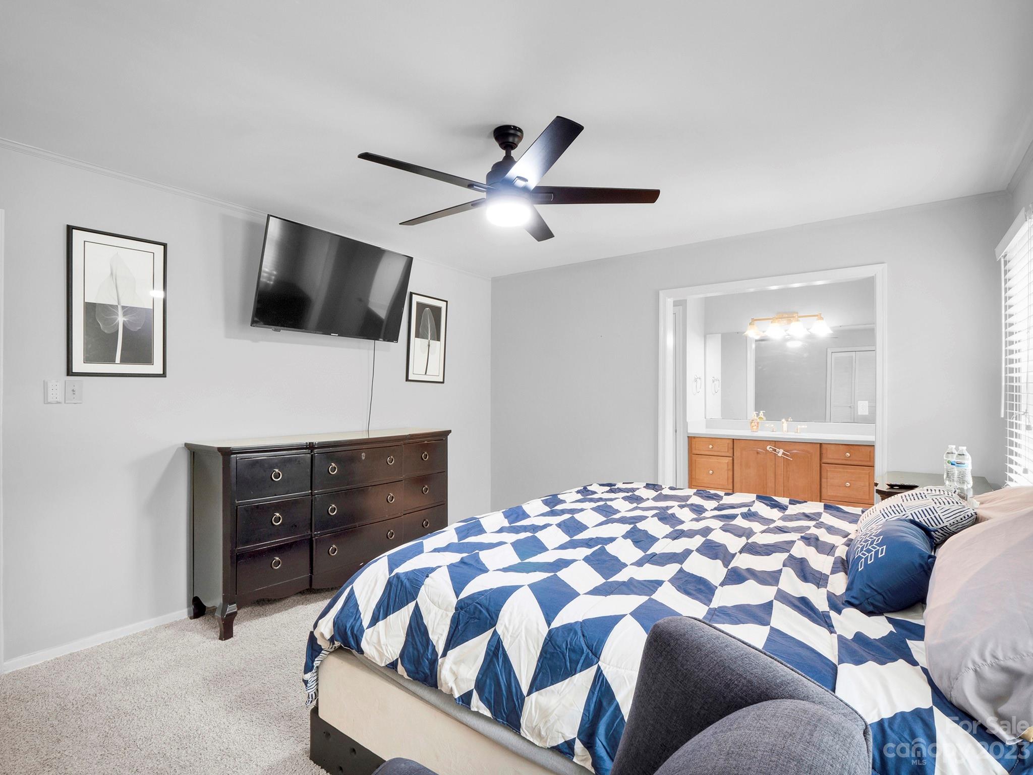 8072 Knights Bridge Road Charlotte, NC 28210 - Photo 12 of 23 a bedroom with a bed and a flat screen tv
