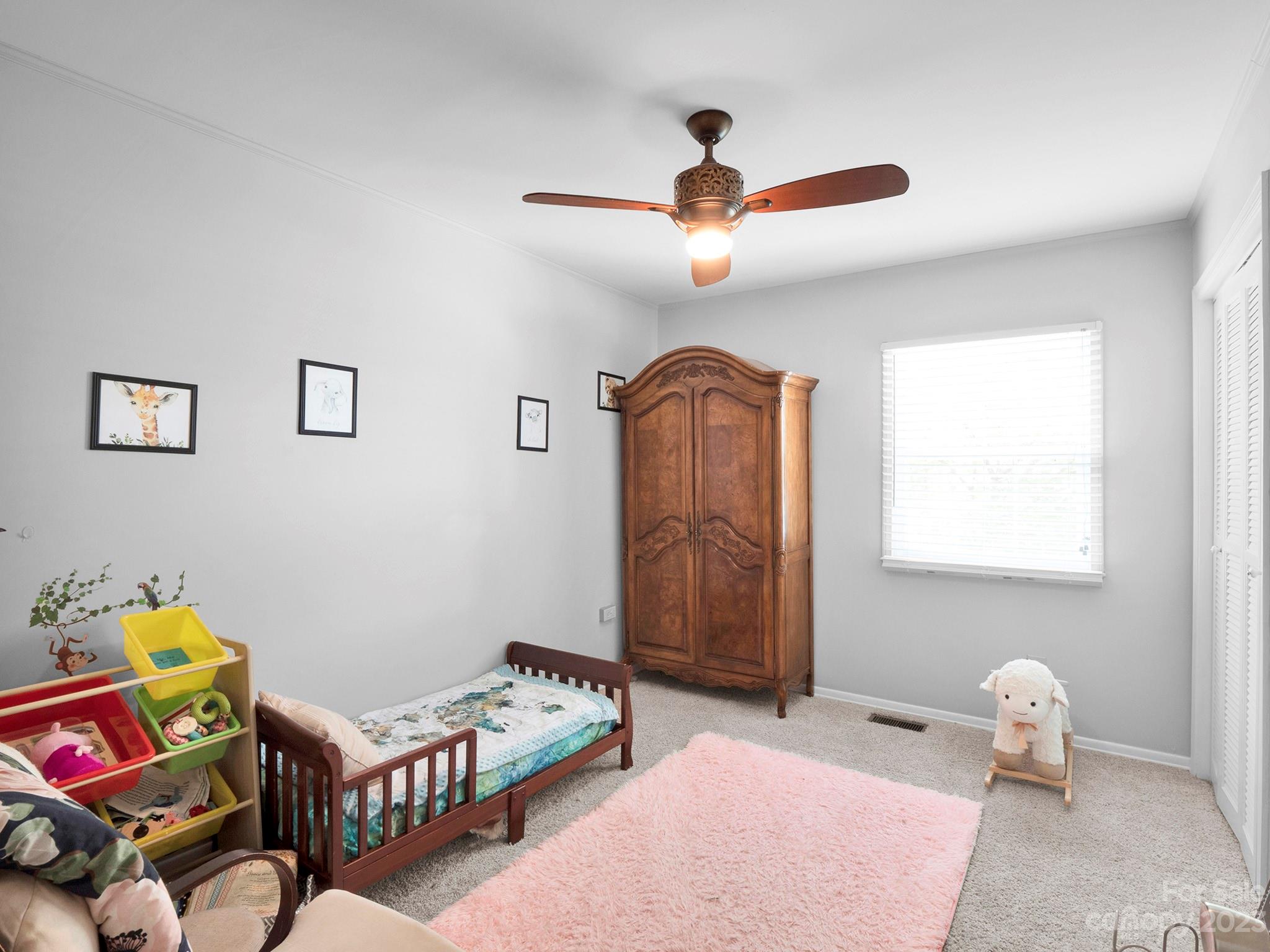 8072 Knights Bridge Road Charlotte, NC 28210 - Photo 14 of 23 a bedroom with furniture and a window