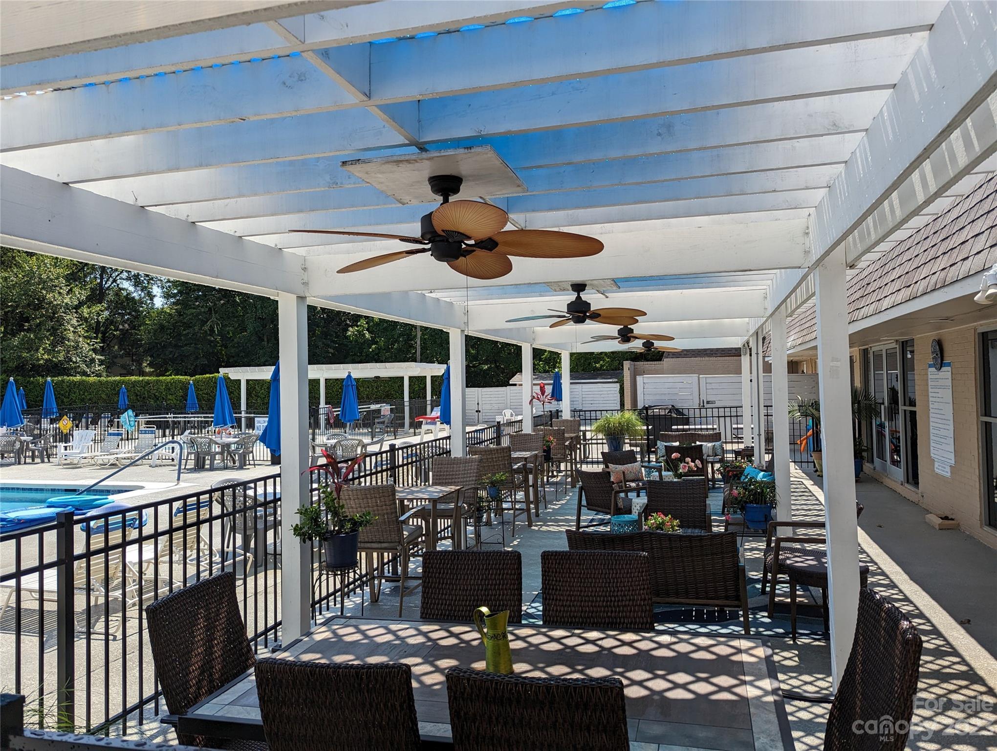 8072 Knights Bridge Road Charlotte, NC 28210 - Photo 22 of 23 a view of a chairs and tables in patio and a balcony