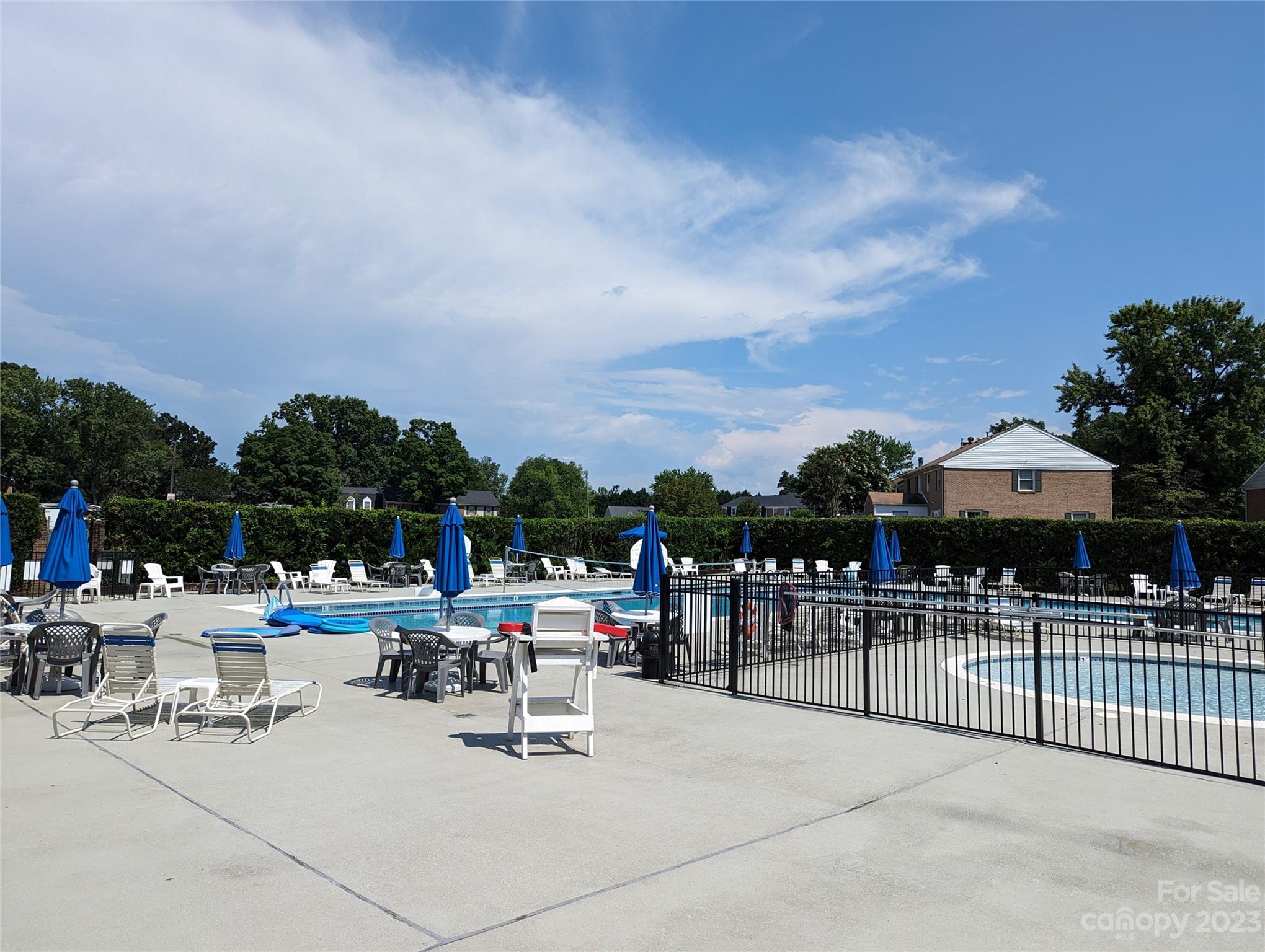 8072 Knights Bridge Road Charlotte, NC 28210 - Photo 23 of 23 a group of lawn chairs under an umbrella