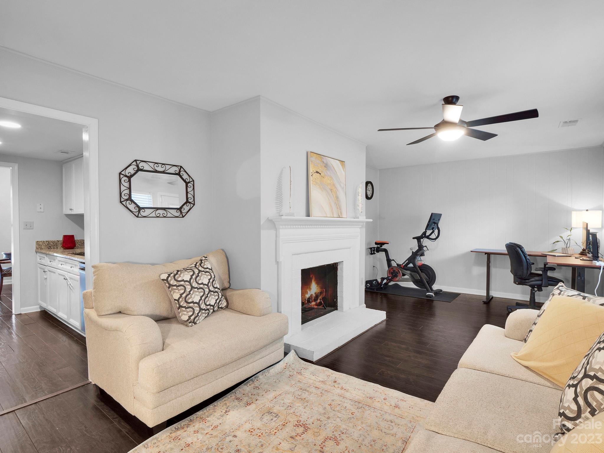 8072 Knights Bridge Road Charlotte, NC 28210 - Photo 8 of 23 a living room with furniture and a fireplace