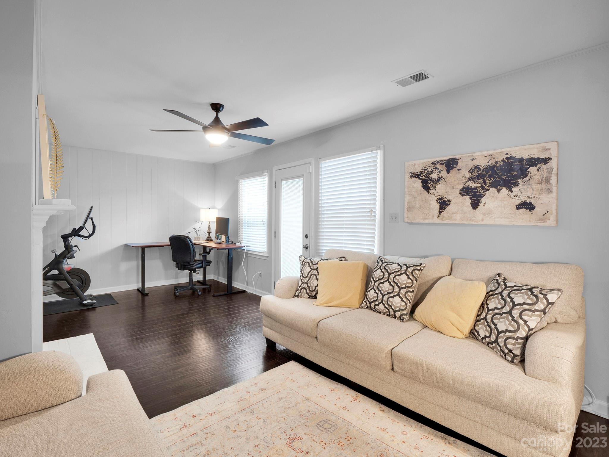 8072 Knights Bridge Road Charlotte, NC 28210 - Photo 9 of 23 a living room with furniture and a chandelier