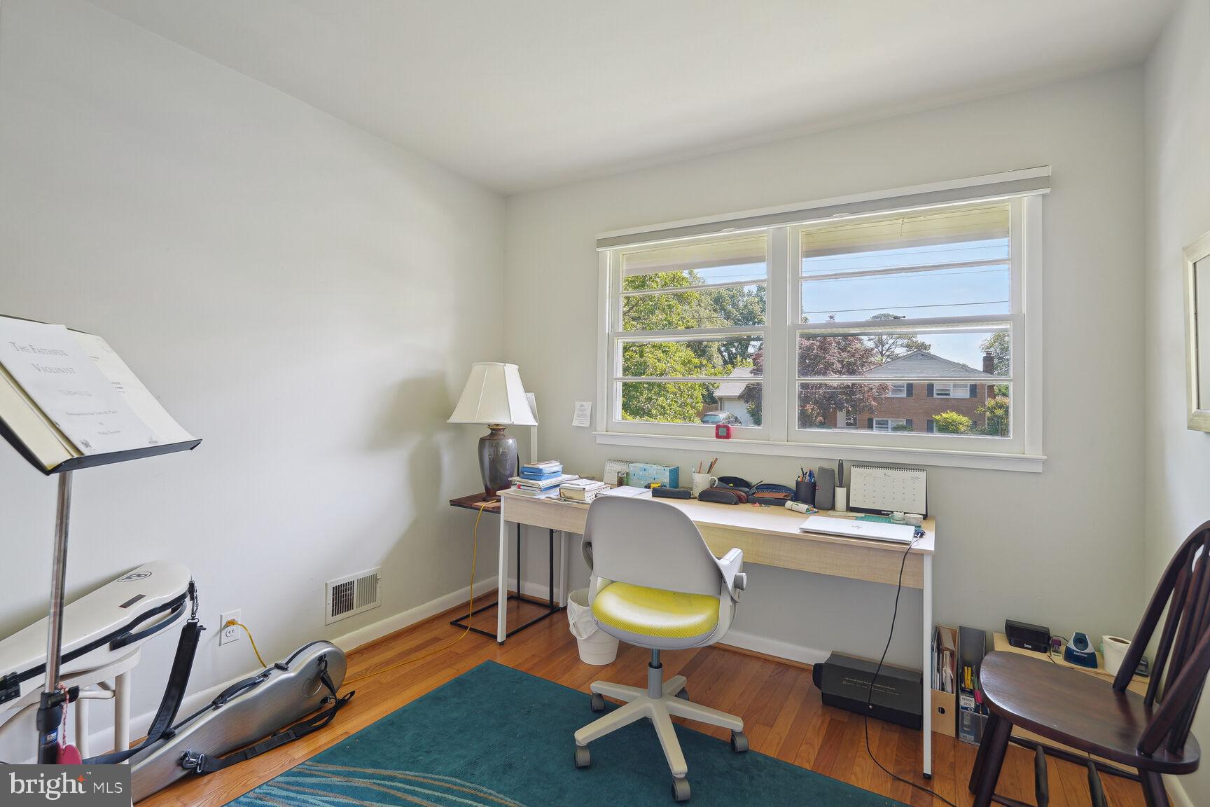 7011 Hector Road McLean, VA 22101 - Photo 12 of 20 a view of a workspace with furniture and a window