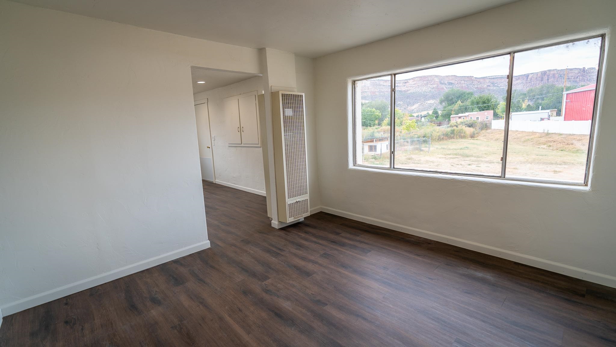 441 South Camp Road Grand Junction, CO 81507 - Photo 14 of 36 an empty room with wooden floor and windows