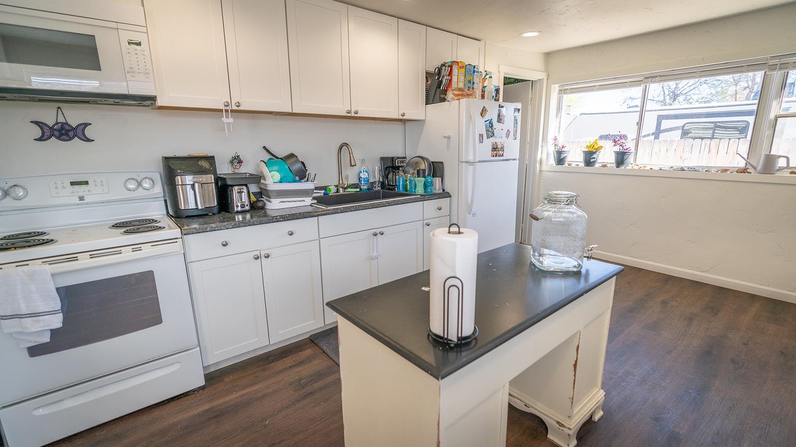 441 South Camp Road Grand Junction, CO 81507 - Photo 15 of 36 a kitchen with stainless steel appliances granite countertop a sink a stove and a refrigerator