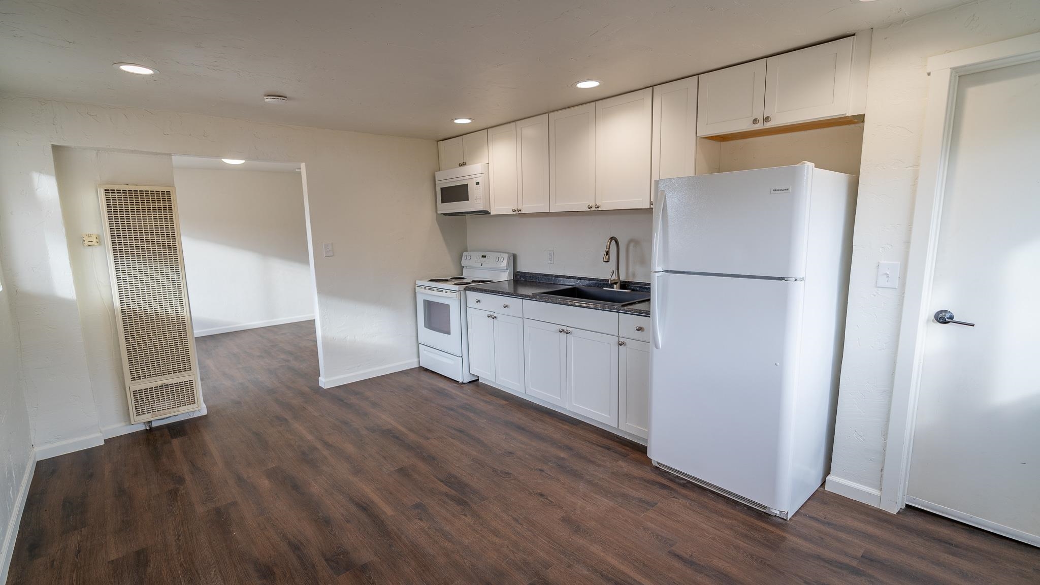 441 South Camp Road Grand Junction, CO 81507 - Photo 18 of 36 a kitchen with a refrigerator a sink and cabinets