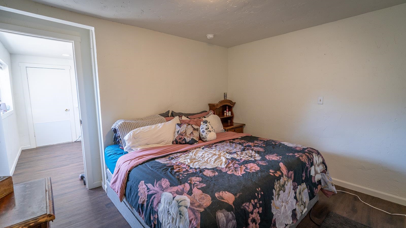 441 South Camp Road Grand Junction, CO 81507 - Photo 21 of 36 a bedroom with a bed and wooden floor
