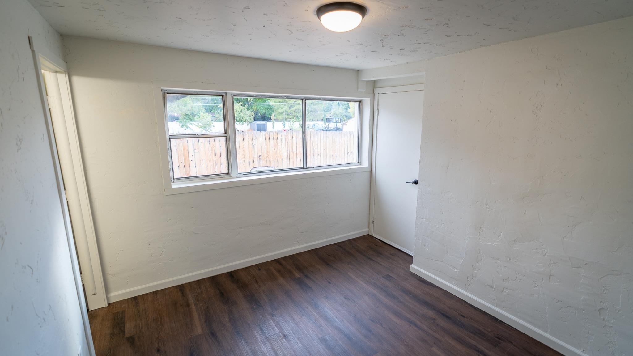 441 South Camp Road Grand Junction, CO 81507 - Photo 23 of 36 an empty room with wooden floor and windows
