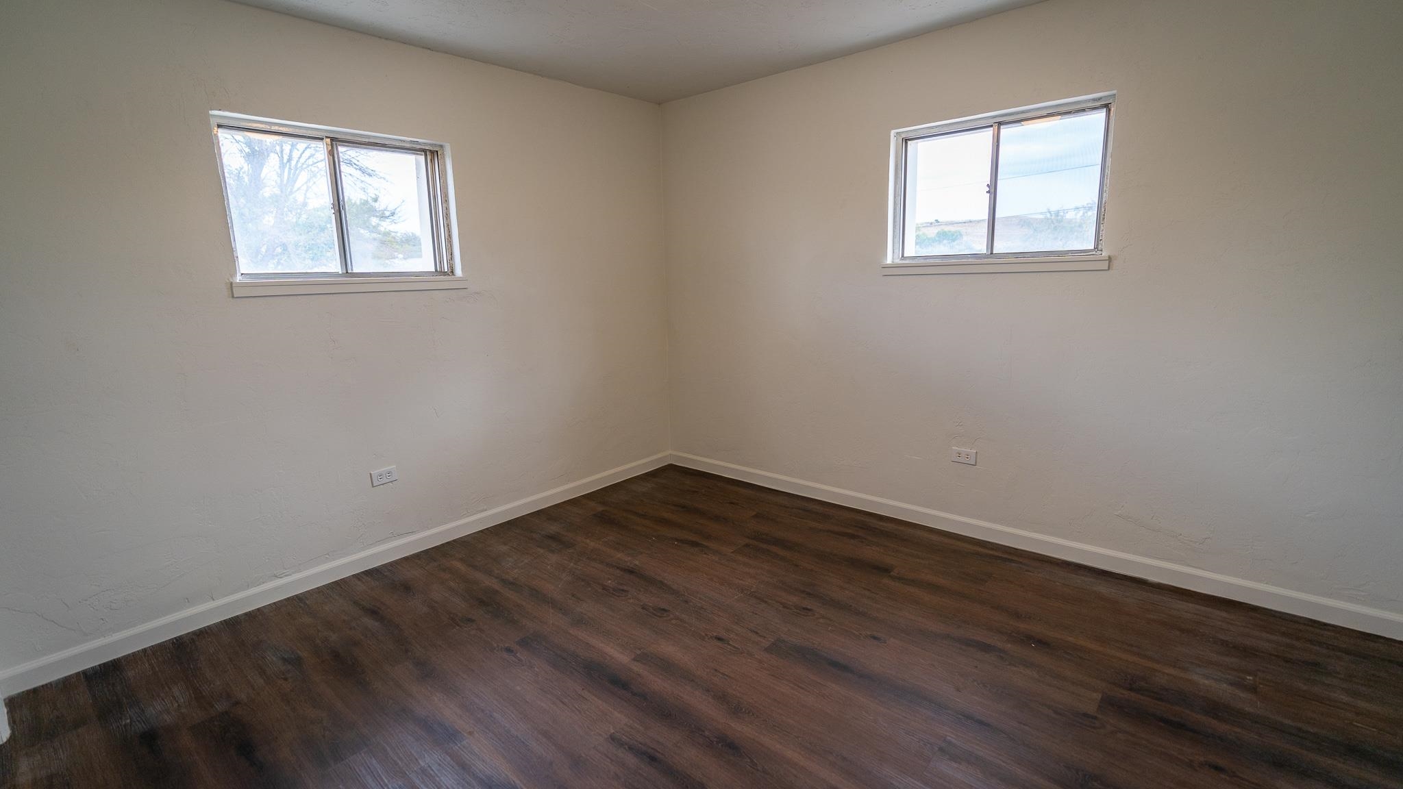 441 South Camp Road Grand Junction, CO 81507 - Photo 28 of 36 a view of an empty room with wooden floor and a window