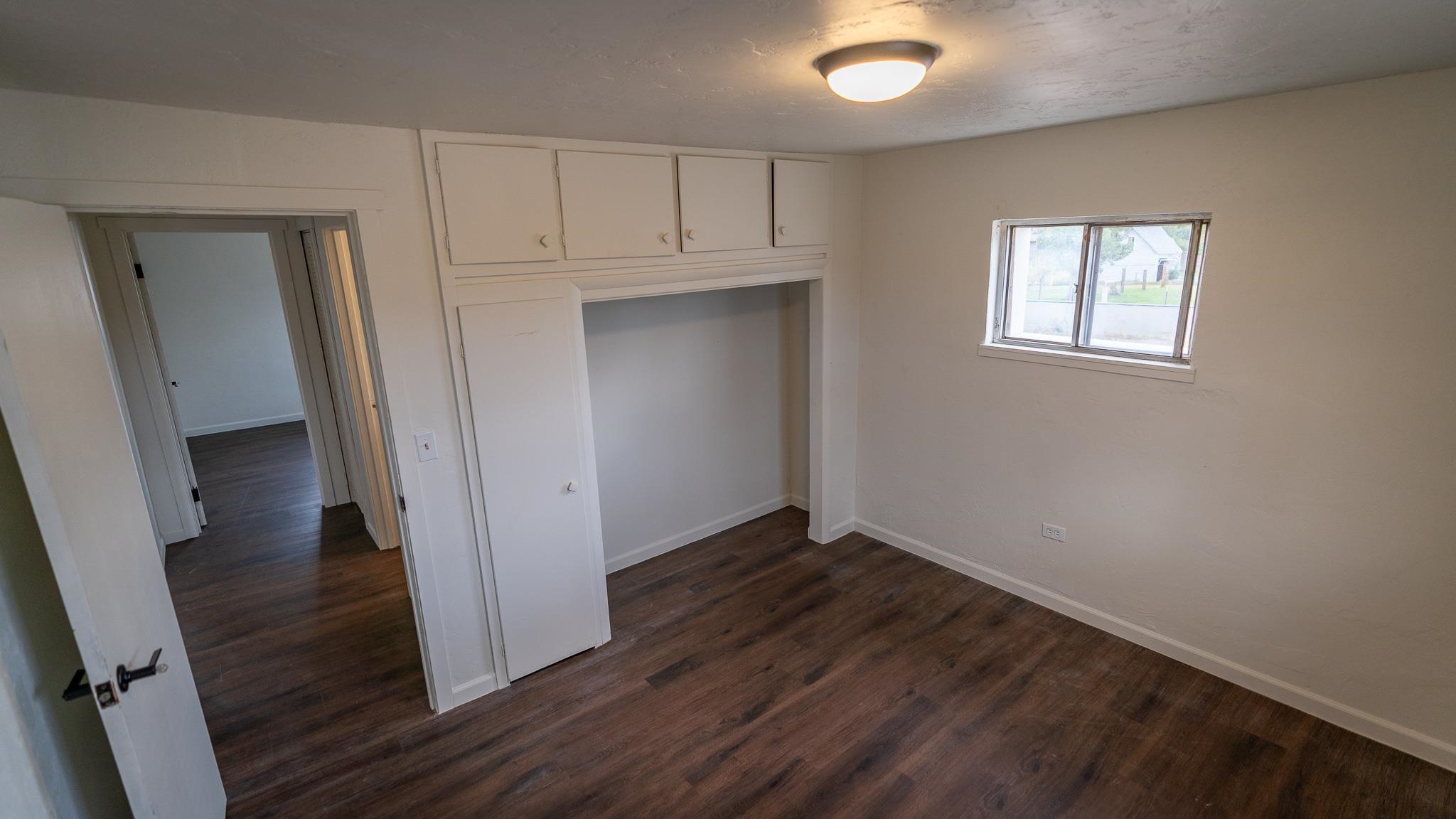 441 South Camp Road Grand Junction, CO 81507 - Photo 30 of 36 a view of an empty room with wooden floor and a window
