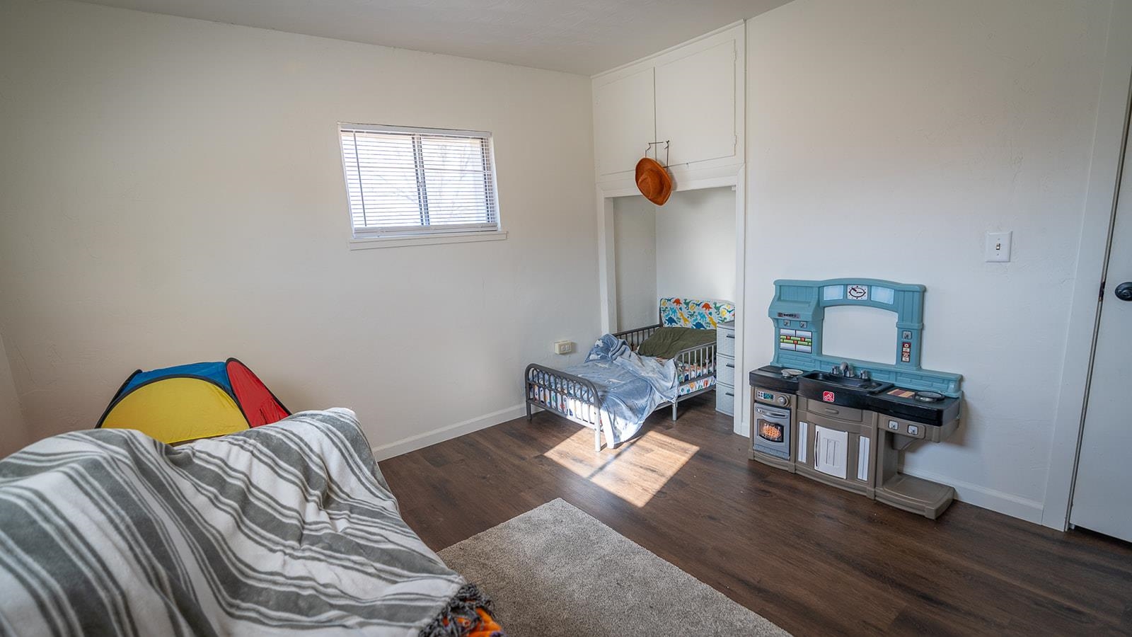 441 South Camp Road Grand Junction, CO 81507 - Photo 33 of 36 a bedroom with a bed and wooden floor