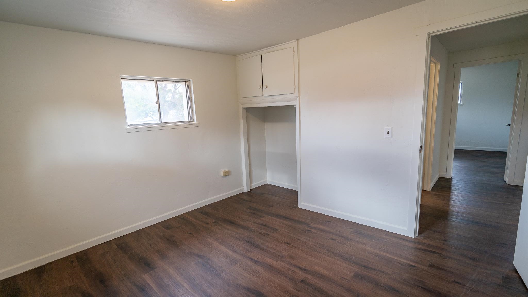 441 South Camp Road Grand Junction, CO 81507 - Photo 34 of 36 an empty room with wooden floor and windows