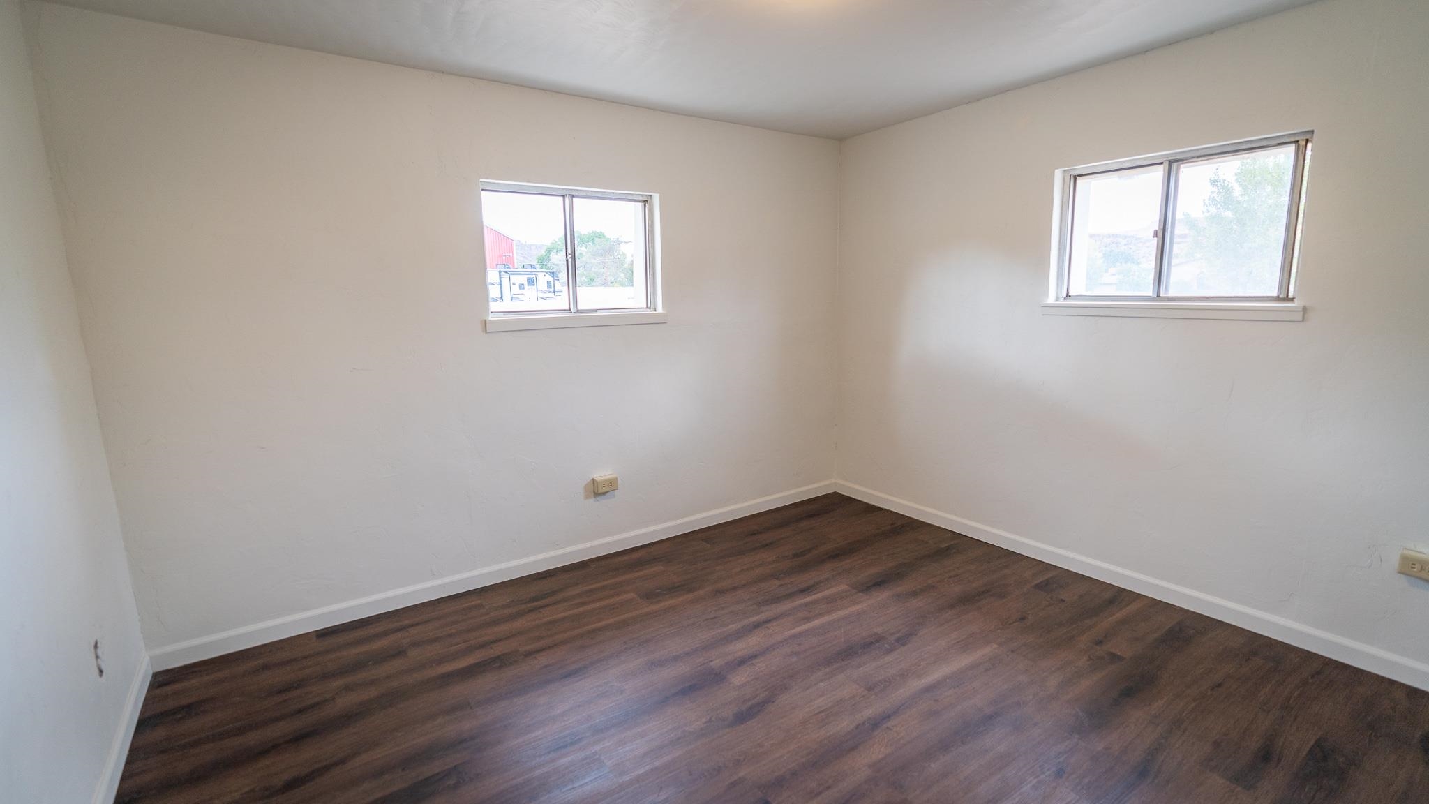 441 South Camp Road Grand Junction, CO 81507 - Photo 36 of 36 an empty room with wooden floor and windows