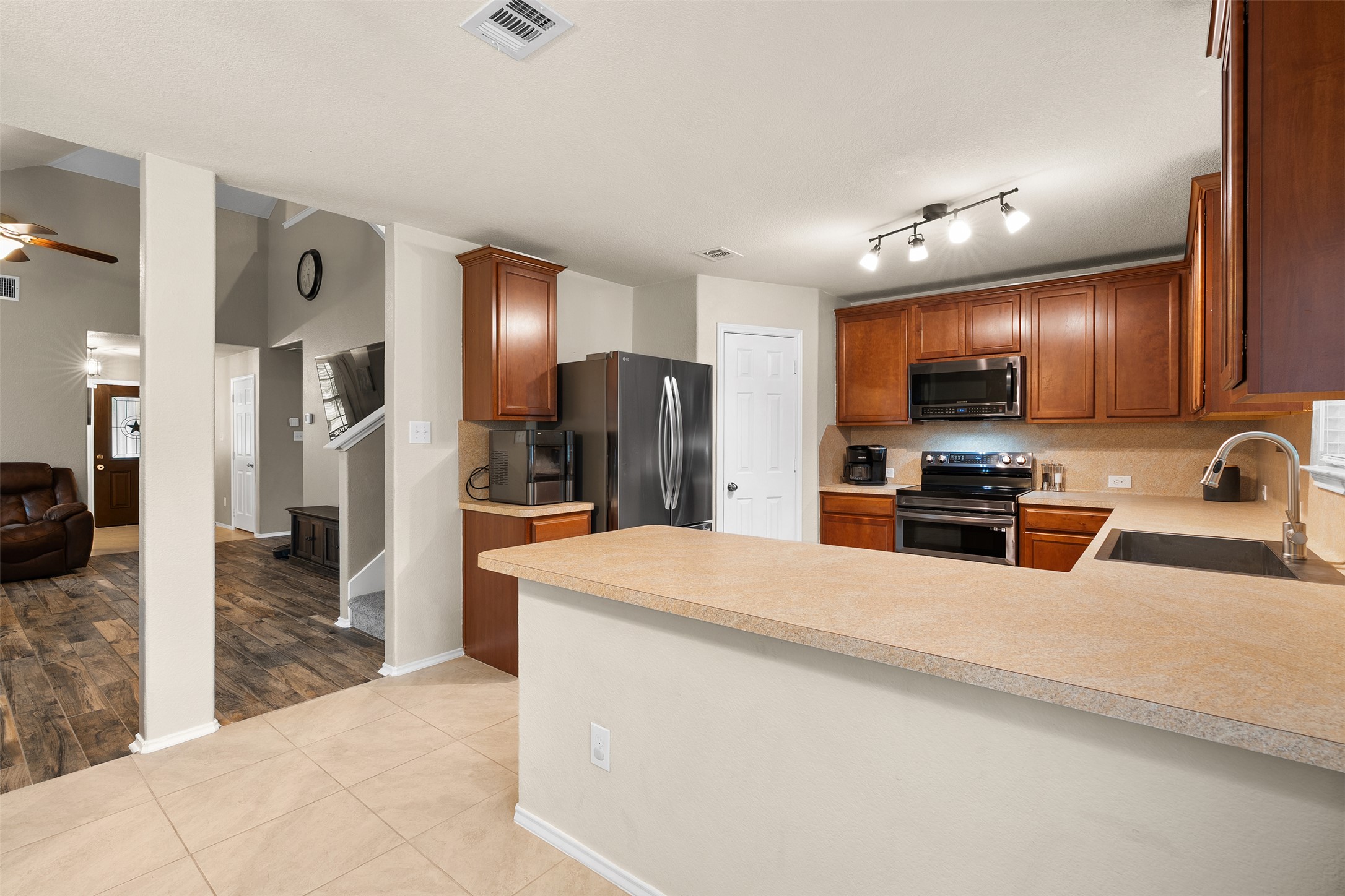 137 Barn Owl Loop Leander, TX 78641 - Photo 14 of 36 a large kitchen with stainless steel appliances