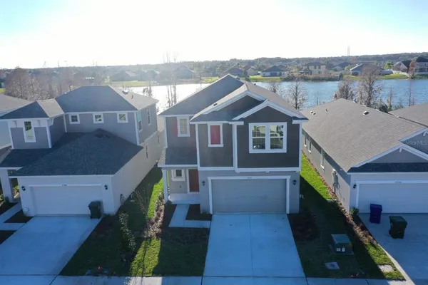 a aerial view of a house with a yard