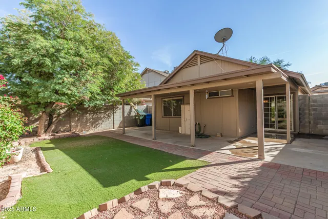 a front view of a house with a yard and porch