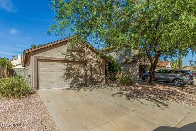 a view of a car parked in front of a house