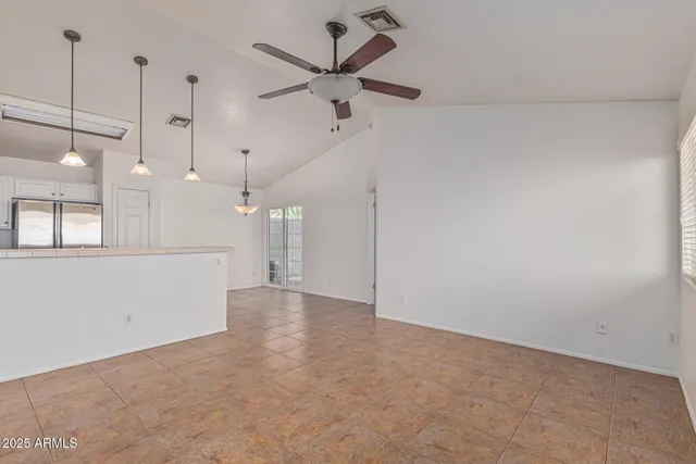 a view of a room with a ceiling fan