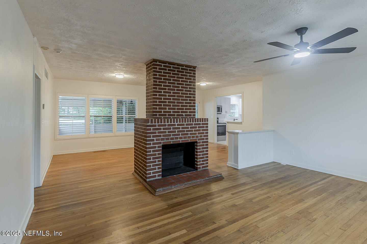 6508 Colgate Road Jacksonville, FL 32217 - Photo 5 of 15 a view of empty room with wooden floor and fan