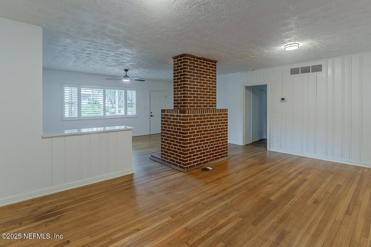 6508 Colgate Road Jacksonville, FL 32217 - Photo 6 of 15 wooden floor in an empty room with a window