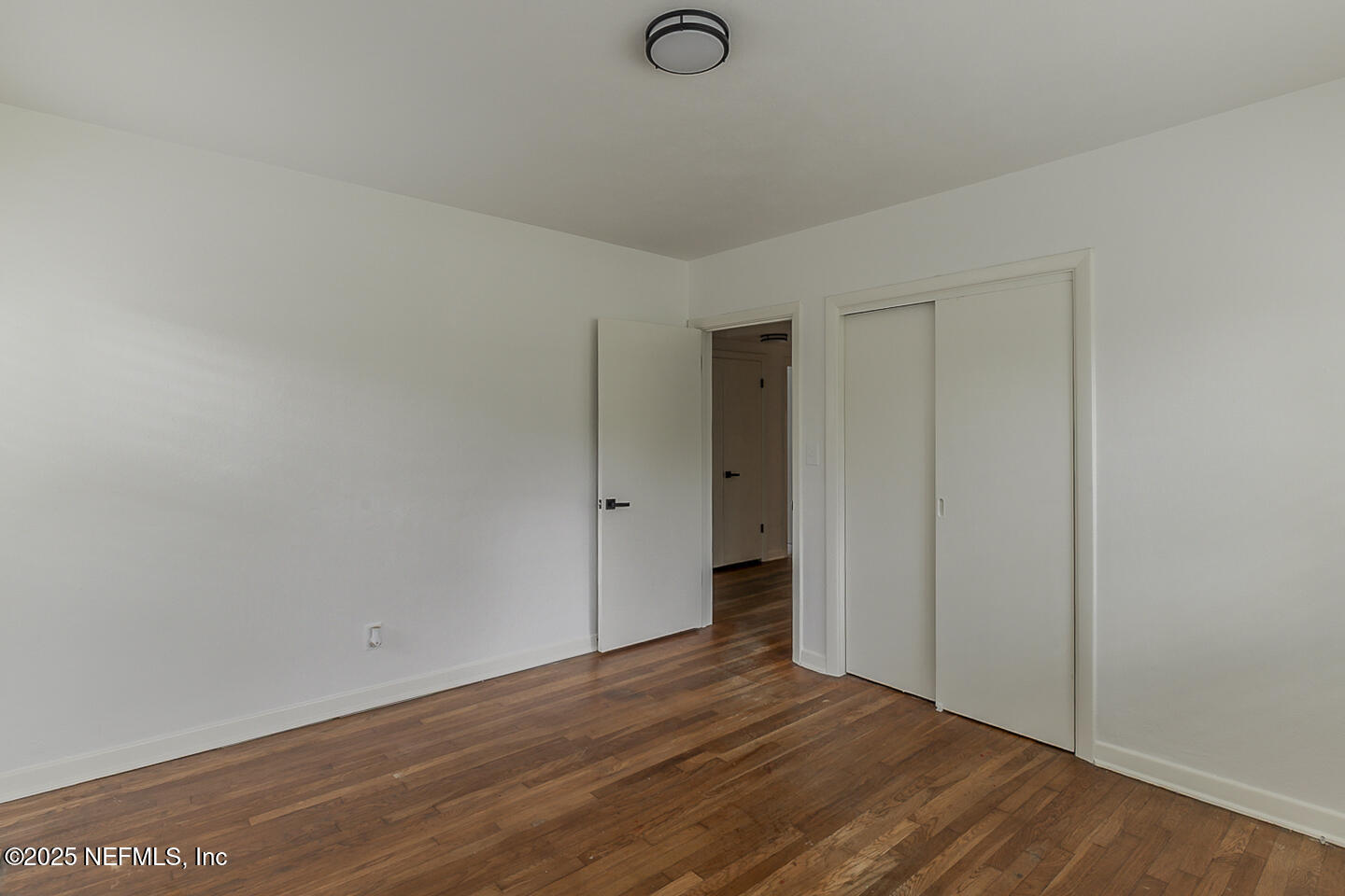 6508 Colgate Road Jacksonville, FL 32217 - Photo 8 of 15 a view of empty room with wooden floor